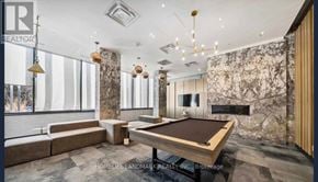 Toronto (Mount Pleasant West) condo for rent - A room with a pool table and a sign that says REALTOR.
