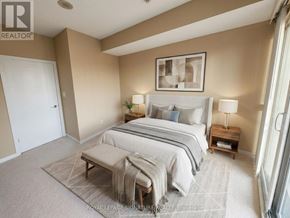 Toronto (Waterfront Communities) condo for rent - A bedroom with a bed, nightstands, and a bench.