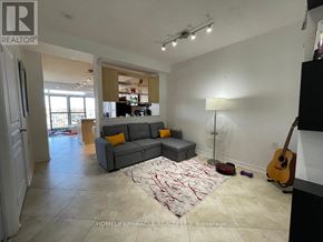 Mississauga (Mississauga Valleys) condo for rent - A living room with a grey couch and a guitar.
