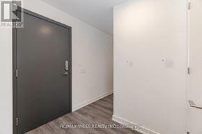Toronto (Niagara) condo for rent - A room with a black door and a white wall.