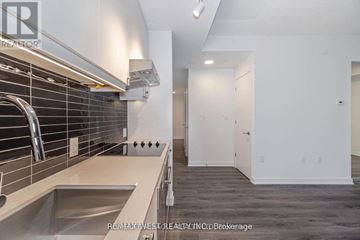Toronto (Niagara) condo for rent - A modern kitchen with a sink and a stainless steel faucet.