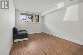 Ottawa multi-family for rent - A room with a window and a bench in it.