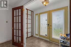 Russell apartment for rent - A room with a brown door and a glass door with a yellow frame.