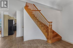 Russell apartment for rent - A wooden staircase in a white room with EXIT REALTY MATRIX logo.