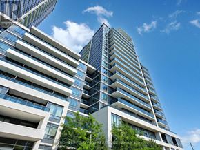 Markham (Grandview) condo for rent - A tall building with many windows is in the foreground and a smaller building is in the background.
