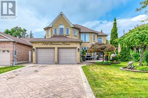 Mississauga (East Credit) apartment for rent - A large house with a driveway in front of it.