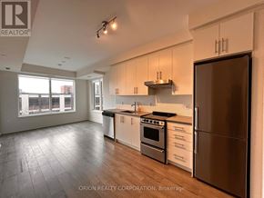 Hamilton (Beasley) condo for rent - A kitchen with a refrigerator, stove, and oven.