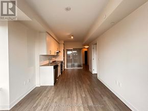 Hamilton (Beasley) condo for rent - A long, narrow hallway with wood flooring and white walls.