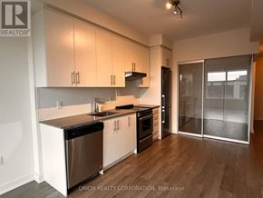 Hamilton (Beasley) condo for rent - A kitchen with white cabinets and a black dishwasher.