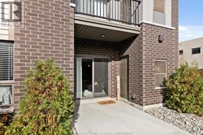 Lasalle condo for rent - A brick building with a balcony and a door.