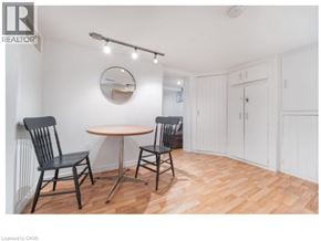 Waterloo apartment for rent - A room with a table and chairs and a mirror on the wall.