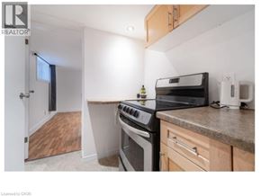 Waterloo apartment for rent - A kitchen with a stove, oven, and microwave.