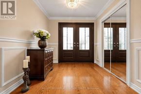 Markham (Milliken Mills East) apartment for rent - A room with a wooden floor and a chandelier.