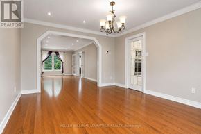 Markham (Milliken Mills East) apartment for rent - A spacious room with wooden floors and a chandelier.
