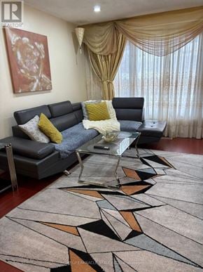 Mississauga (Malton) apartment for rent - A living room with a grey couch and a coffee table.