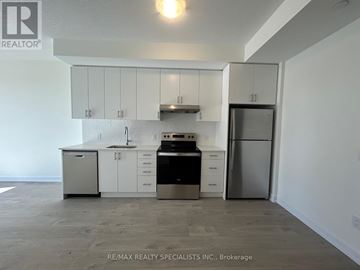 Oakville (Jm Joshua Meadows) condo for rent - A kitchen with white cabinets and stainless steel appliances.