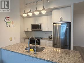 Toronto (Henry Farm) condo for rent - A kitchen with granite countertops and stainless steel appliances.