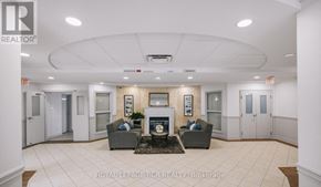 King (Schomberg) condo for rent - A living room with a fireplace and two couches.