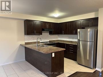 Niagara Falls (Brown) apartment for rent - A kitchen with a granite countertop and stainless steel appliances.