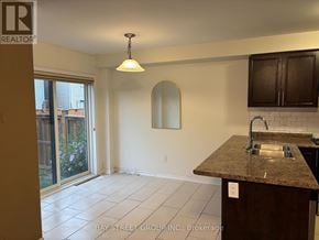 Niagara Falls (Brown) apartment for rent - A kitchen with a granite countertop and a sink.