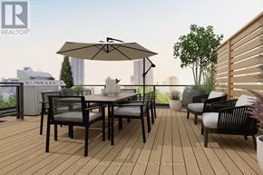 Ottawa multi-family for rent - A patio with a table and chairs and a large umbrella.