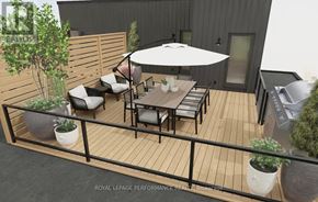 Ottawa multi-family for rent - A patio with a table and chairs and a white umbrella.