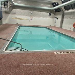 Toronto (West Hill) condo for rent - A swimming pool with the words "SHALLOW END" written on the floor.