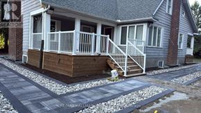 Aurora (Bayview Southeast) apartment for rent - A house with a grey roof and a white porch.