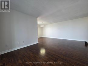 Brampton (Brampton 407 Corridor) condo for rent - A room with wooden floors and white walls.