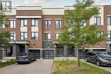 Vaughan townhouse for rent - A building with the text RETREND REALTY LTD, Brokerage on the side.