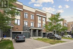 Vaughan townhouse for rent - A building with the sign "RETAIN REALTY LTD Brokerage" in front of it.