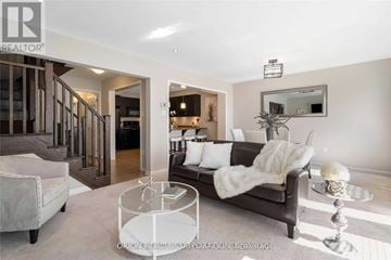 Milton (Wi Willmott) townhouse for rent - A living room with a couch, chair, and coffee table.