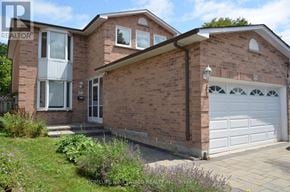 Markham (Raymerville) apartment for rent - A brick house with a white garage door and a number 50 on the wall.