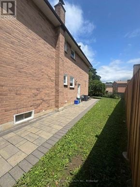 Markham (Raymerville) apartment for rent - A brick building with a blue REALTY INC. sign on the bottom left.