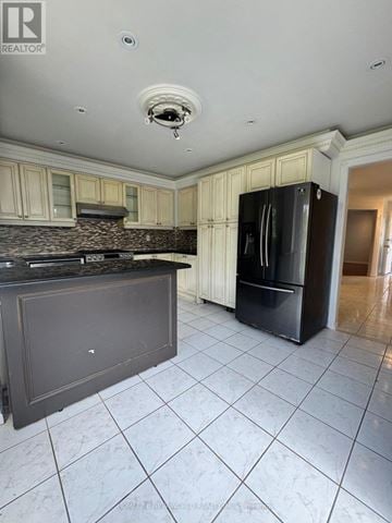 Markham (Raymerville) apartment for rent - A kitchen with a black fridge and a black counter top.