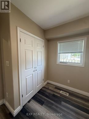 St. Catharines (Facer) apartment for rent - A room with a white door and a window with blinds.
