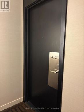Toronto (Willowdale East) condo for rent - A black door with a silver handle and a number 4121 on it.