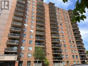 Mississauga (Lakeview) multi-family for rent - A tall apartment building with balconies and windows.