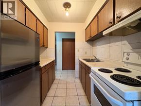 Windsor multi-family for rent - A kitchen with a stove, refrigerator, and sink.