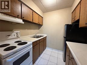Windsor multi-family for rent - A kitchen with a white stove and black refrigerator.
