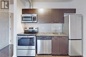 Toronto (Little Portugal) condo for rent - A kitchen with a stainless steel refrigerator, oven, and dishwasher.