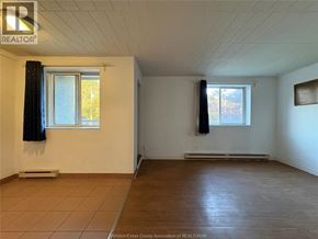 Windsor multi-family for rent - A room with a window and a radiator.