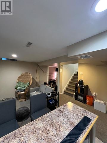Brampton (Brampton West) apartment for rent - A living room with a grey couch and a marble table.