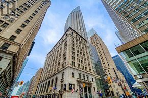 Toronto (Bay Street Corridor) condo for rent - A cityscape with a mix of old and new buildings.