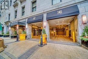 Toronto (Bay Street Corridor) condo for rent - The image shows a building entrance with a black awning that reads "111".