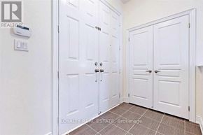 Richmond Hill (Oak Ridges) apartment for rent - A white door with a silver handle is closed.