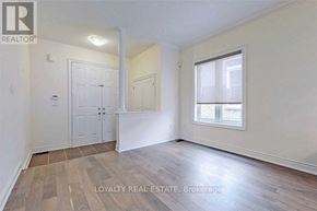 Richmond Hill (Oak Ridges) apartment for rent - A room with a door, a window, and a wooden floor.