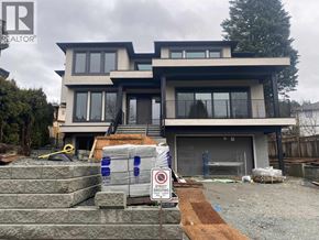 Burnaby apartment for rent - A house under construction with a sign in front that says "STOP SWEEPING".