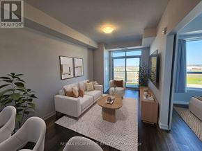 Lincoln (Lincoln Lake) condo for rent - A living room with a white couch, a coffee table, and a large window.