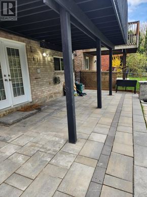 Mississauga (Streetsville) apartment for rent - A patio with a black metal post and a bench.